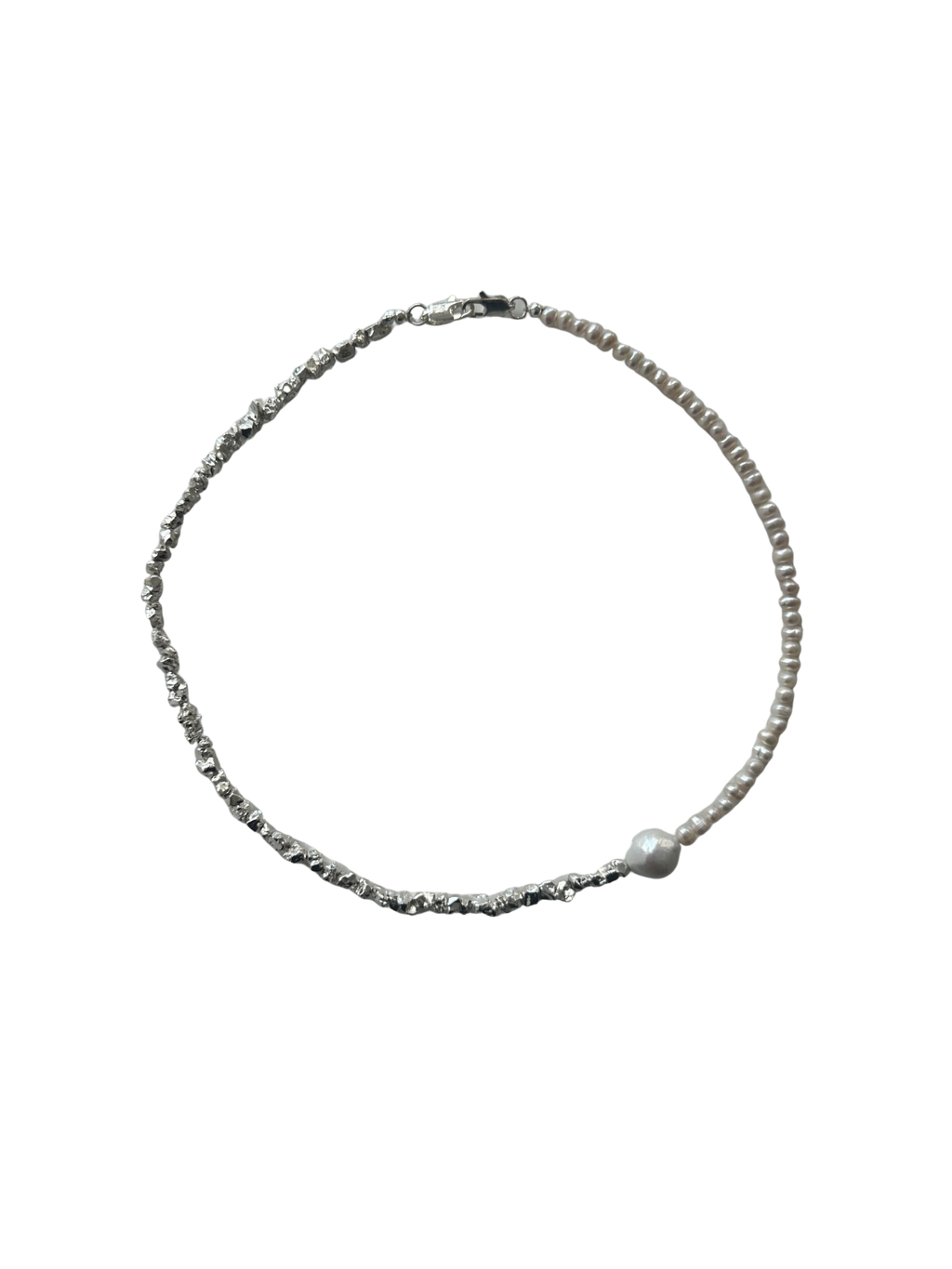 Necklace with a single pearl on a white background